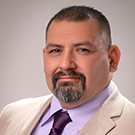 headshot of UC Davis Human Services instructor Roger de Leon