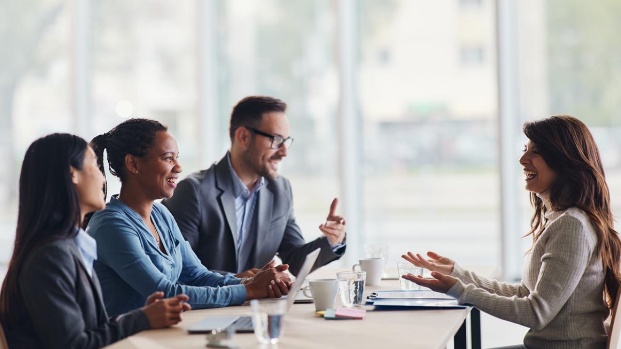 woman sits on an interview panel