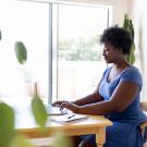 young woman on laptop at home